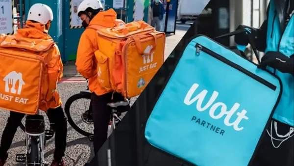 שליח עם תיק משלוחים מחוץ למסעדה בבאר שבע, על רקע השקת אפליקציית משלוחים חדשה בעיר